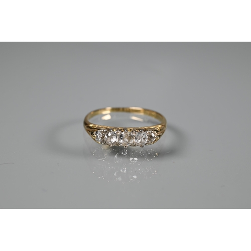 296 - A five stone diamond ring, the graduated old cut diamonds set unmarked yellow metal, size O; a three... 