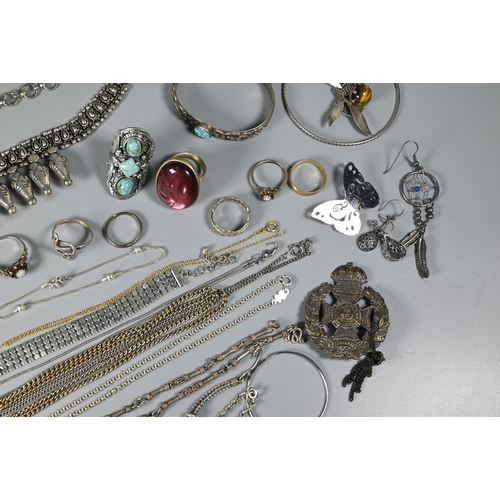 302A - A collection of gilt metal and yellow metal jewellery items including earrings, chains etc, white me... 