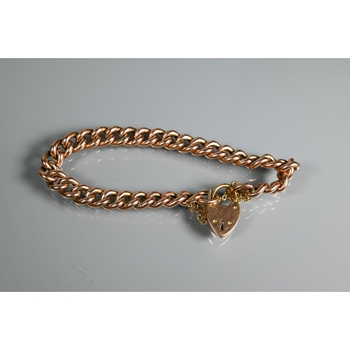 303 - A 9ct rose gold curb bracelet, 15.7g; a gilt metal curb bracelet and an unmarked wheat link chain (3... 