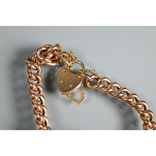 303 - A 9ct rose gold curb bracelet, 15.7g; a gilt metal curb bracelet and an unmarked wheat link chain (3... 