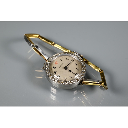 306 - Rolex - A diamond set cocktail watch with round engine turned dial and Arabic numerals, yellow and w... 