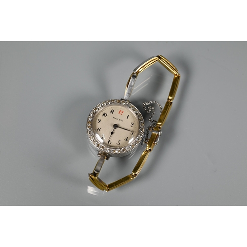 306 - Rolex - A diamond set cocktail watch with round engine turned dial and Arabic numerals, yellow and w... 