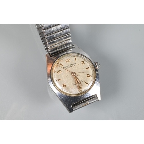 310 - Winegartens, London, two gents vintage wristwatches - one 9ct gold cased manual, champagne dial, run... 