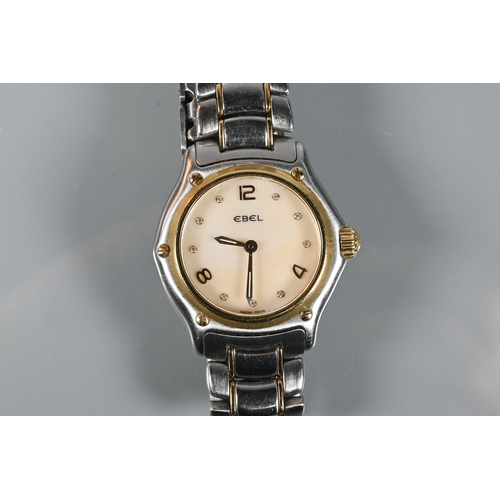 311 - An Ebel ladies 1911 model stainless steel and 18ct gold wristwatch, the mother of pearl dial set wit... 