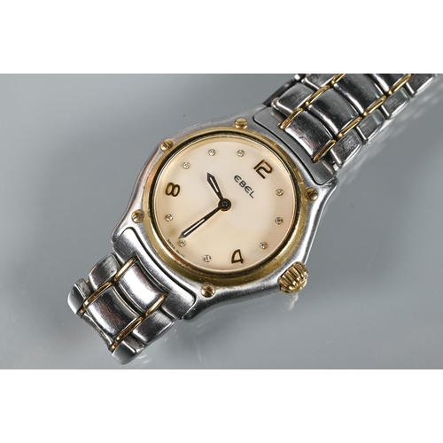 311 - An Ebel ladies 1911 model stainless steel and 18ct gold wristwatch, the mother of pearl dial set wit... 