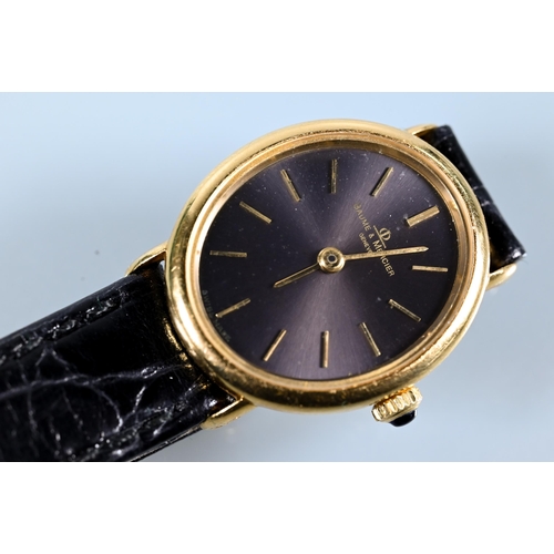 313 - A ladies Baume & Mercier 18ct gold wristwatch, manual with sapphire set winder, oval, the oval t... 