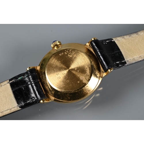 313 - A ladies Baume & Mercier 18ct gold wristwatch, manual with sapphire set winder, oval, the oval t... 