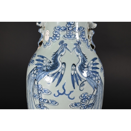 350 - A 19th century Chinese baluster vase applied with guardian lions, the neck painted in underglaze blu... 