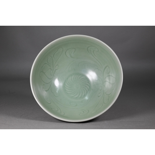 352 - A Chinese longquan celadon 'lotus' bowl with opaque green glaze covering the foliate incise interior... 