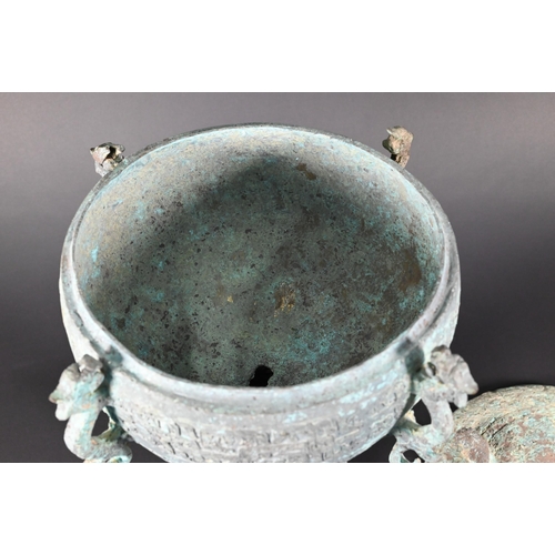 356 - A Chinese bronze ritual food vessel and cover in the Warring States style, Dou, the bowl has four ca... 