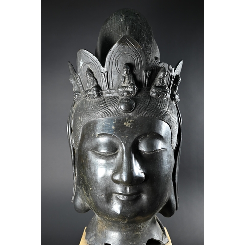 357 - A Himalayan patinated bronze crowned head of  Ksitigarbha (translated as 'earth treasury' or 'earth ... 