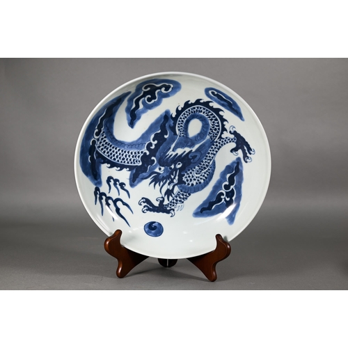 358 - A Chinese transitional style blue and white dragon charger in the mid 17th century manner, painted i... 