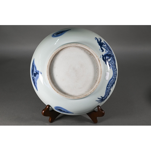 358 - A Chinese transitional style blue and white dragon charger in the mid 17th century manner, painted i... 