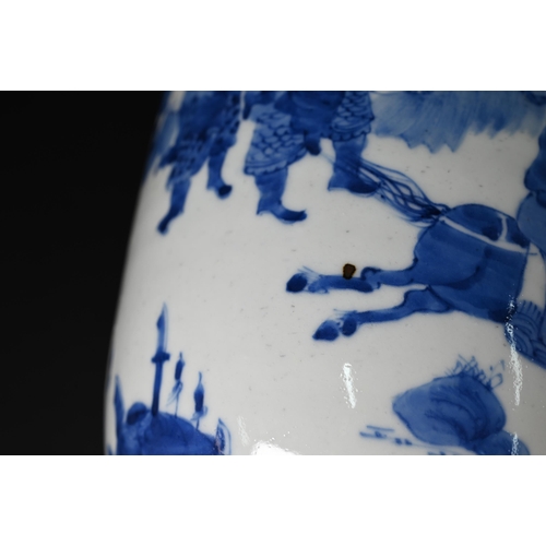 362 - A Chinese Kangxi style blue and white rouleau vase painted in rich tones of underglaze blue with a c... 