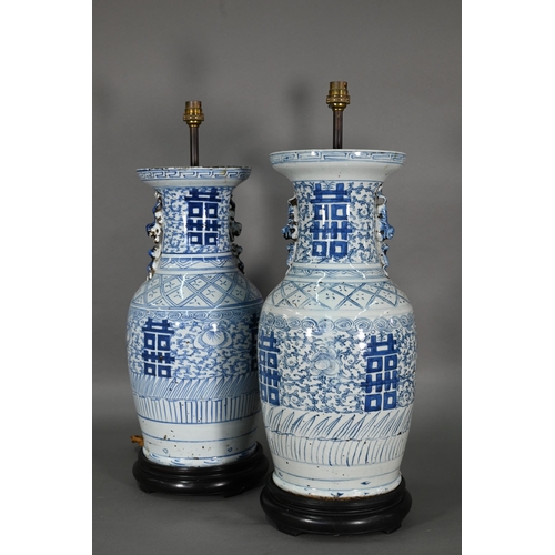 363 - A pair of 19th century Chinese blue and white lamp mounted wedding vases, painted with floral scroll... 