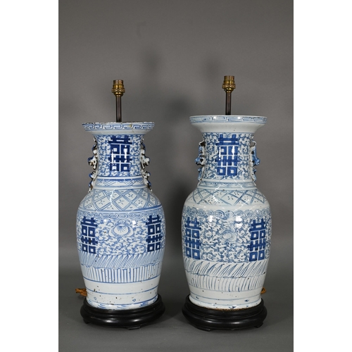 363 - A pair of 19th century Chinese blue and white lamp mounted wedding vases, painted with floral scroll... 