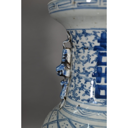 363 - A pair of 19th century Chinese blue and white lamp mounted wedding vases, painted with floral scroll... 