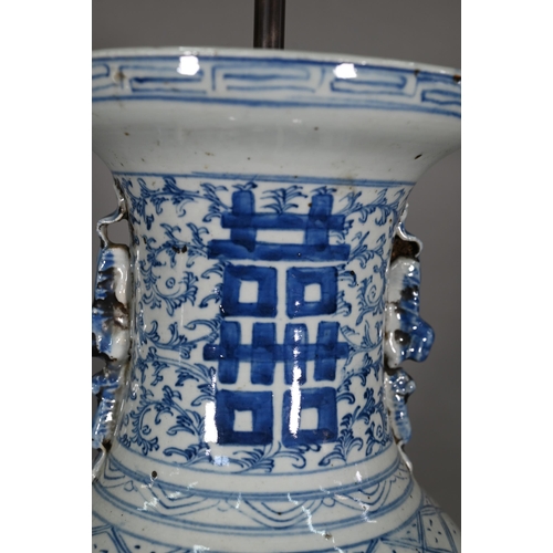 363 - A pair of 19th century Chinese blue and white lamp mounted wedding vases, painted with floral scroll... 