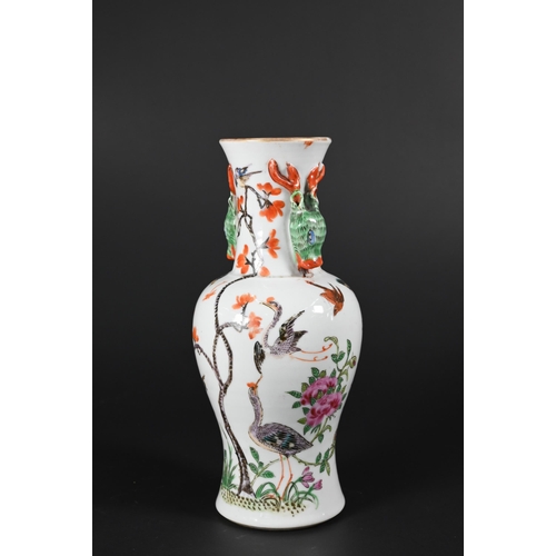 364 - A small 19th century Chinese famille rose baluster vase applied with gilded rim and moulded stag hea... 