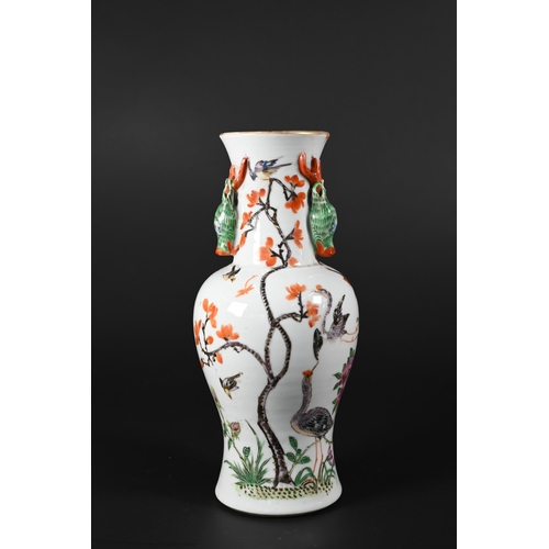 364 - A small 19th century Chinese famille rose baluster vase applied with gilded rim and moulded stag hea... 