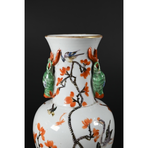 364 - A small 19th century Chinese famille rose baluster vase applied with gilded rim and moulded stag hea... 