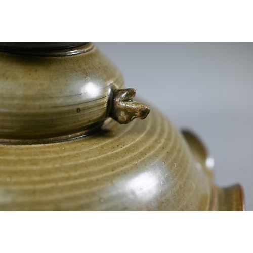 368 - A Chinese Song style stemmed fruit dish with olive green glaze and relief mythical beast decoration,... 