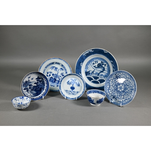 369 - A group of 18th century Chinese blue and white ceramics including a Kangxi period dragon and carp pl... 