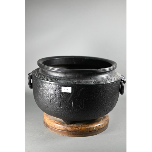 377 - A large Japanese cast iron tripod hibachi (traditional brazier) cast with key-fret thunder pattern b... 