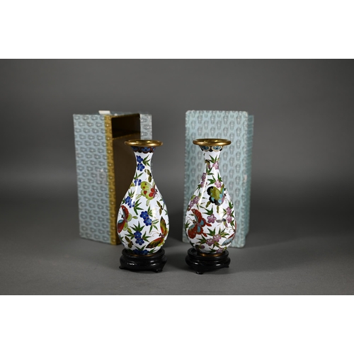 378 - A pair of Japanese cloisonne vases decorated with butterflies and flowers in polychrome enamels on w... 