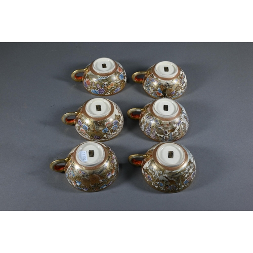 379 - A Japanese Satsuma tea service by Hododa, comprising teapot, milk jug and sugar bowl all with covers... 