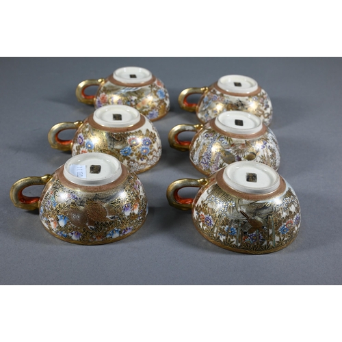 379 - A Japanese Satsuma tea service by Hododa, comprising teapot, milk jug and sugar bowl all with covers... 