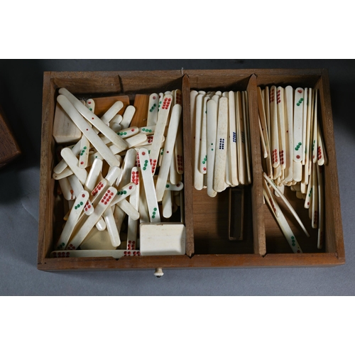 381 - A Chinese Mah Jong set, the carved wooden and brass mounted case with two carry handles and sliding ... 