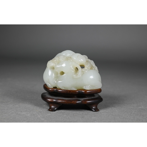 383 - An 18th century Chinese jade carving of three rams, sanyang, with swirling clouds and a yinyang symb... 