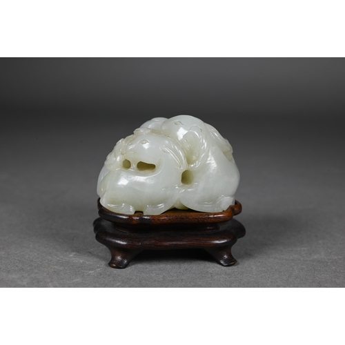 383 - An 18th century Chinese jade carving of three rams, sanyang, with swirling clouds and a yinyang symb... 