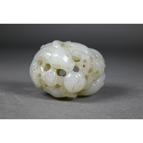 383 - An 18th century Chinese jade carving of three rams, sanyang, with swirling clouds and a yinyang symb... 