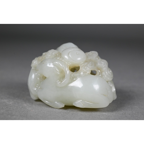 383 - An 18th century Chinese jade carving of three rams, sanyang, with swirling clouds and a yinyang symb... 