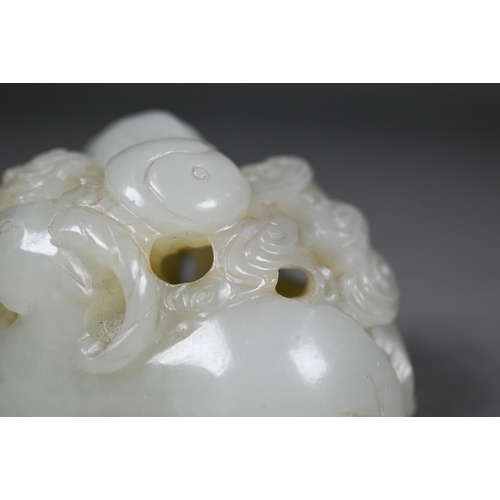 383 - An 18th century Chinese jade carving of three rams, sanyang, with swirling clouds and a yinyang symb... 