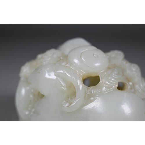 383 - An 18th century Chinese jade carving of three rams, sanyang, with swirling clouds and a yinyang symb... 