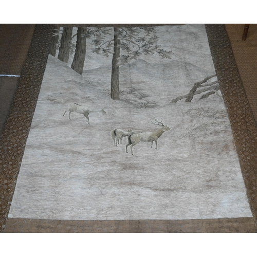 391 - An early 20th century Japanese textile wall hanging, ink on fabric landscape with long wooden pedest... 