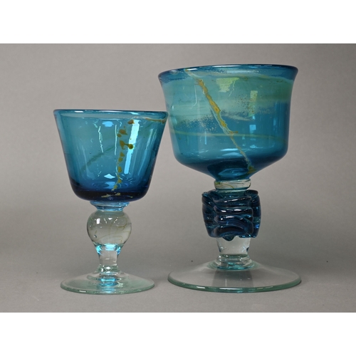 415 - A Mdina blue glass goblet, signed and dated 1977, 16 cm, to/w a larger unsigned goblet with free for... 