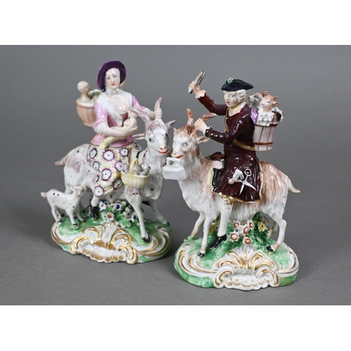 437 - A pair of Georgian Derby groups, The Welch Tailor and His Wife, mounted on goats, on shell-moulded b... 