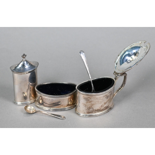 44 - A cased heavy quality silver three-piece condiment set with spoons and blue glass liners, B Chatterl... 