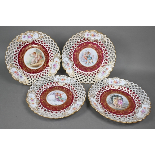 493 - A matched set of four Meissen/Dresden cabinet plates painted with children - three in winter setting... 