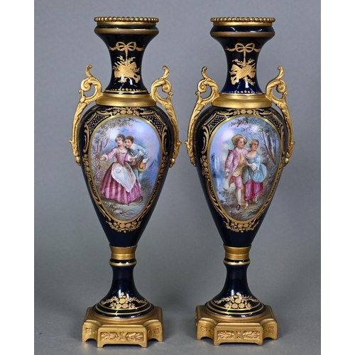 500 - A pair of late 19th century Sèvres porcelain garniture vases of slender baluster form with domed cov... 