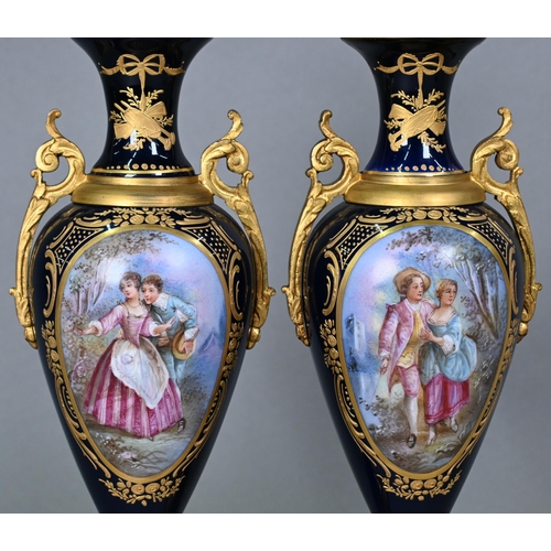 500 - A pair of late 19th century Sèvres porcelain garniture vases of slender baluster form with domed cov... 