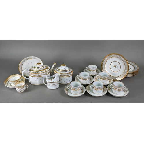 501 - A Regency china oval teapot, covered sugar basin and milk jug with gilt decoration and six matching ... 