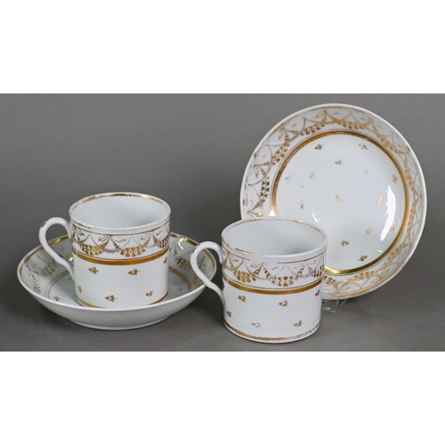 501 - A Regency china oval teapot, covered sugar basin and milk jug with gilt decoration and six matching ... 