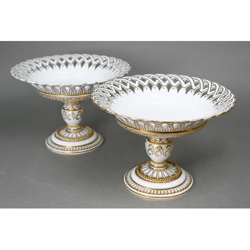 503 - A pair of Victorian Staffordshire china fruit comports with pierced basketwork rims and gilt decorat... 