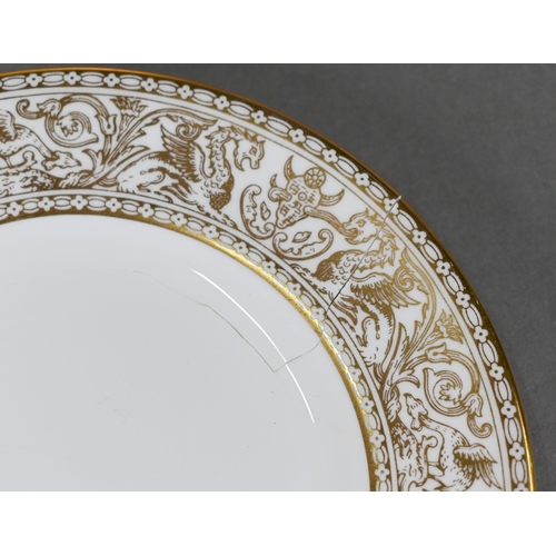 518 - A Wedgwood Gold Florentine dinner service for eight settings, including dinner plates, dessert plate... 