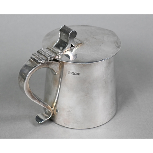 54 - An Edwardian Arts & Crafts silver lidded jug of squat, tapering cylindrical form with flat lid a... 